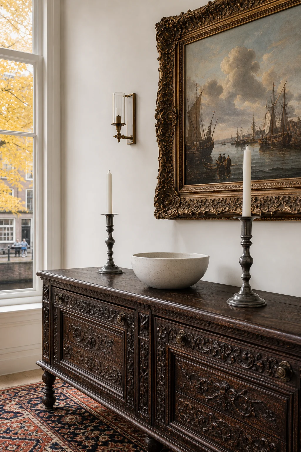 Dark walnut sideboard styled with a modern minimal white ceramic bowl and pewter candlesticks.