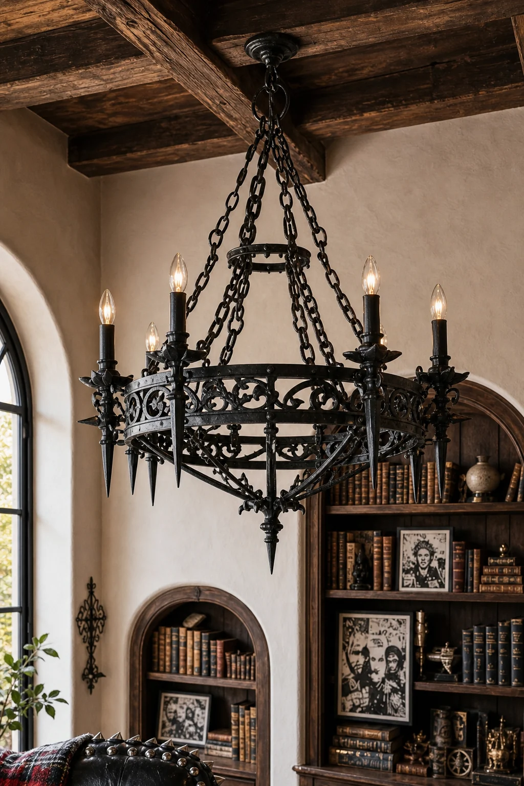 Low-angle shot of a wrought-iron chandelier blending classic scrollwork with sharp, punk-inspired spikes against a stucco ceiling.