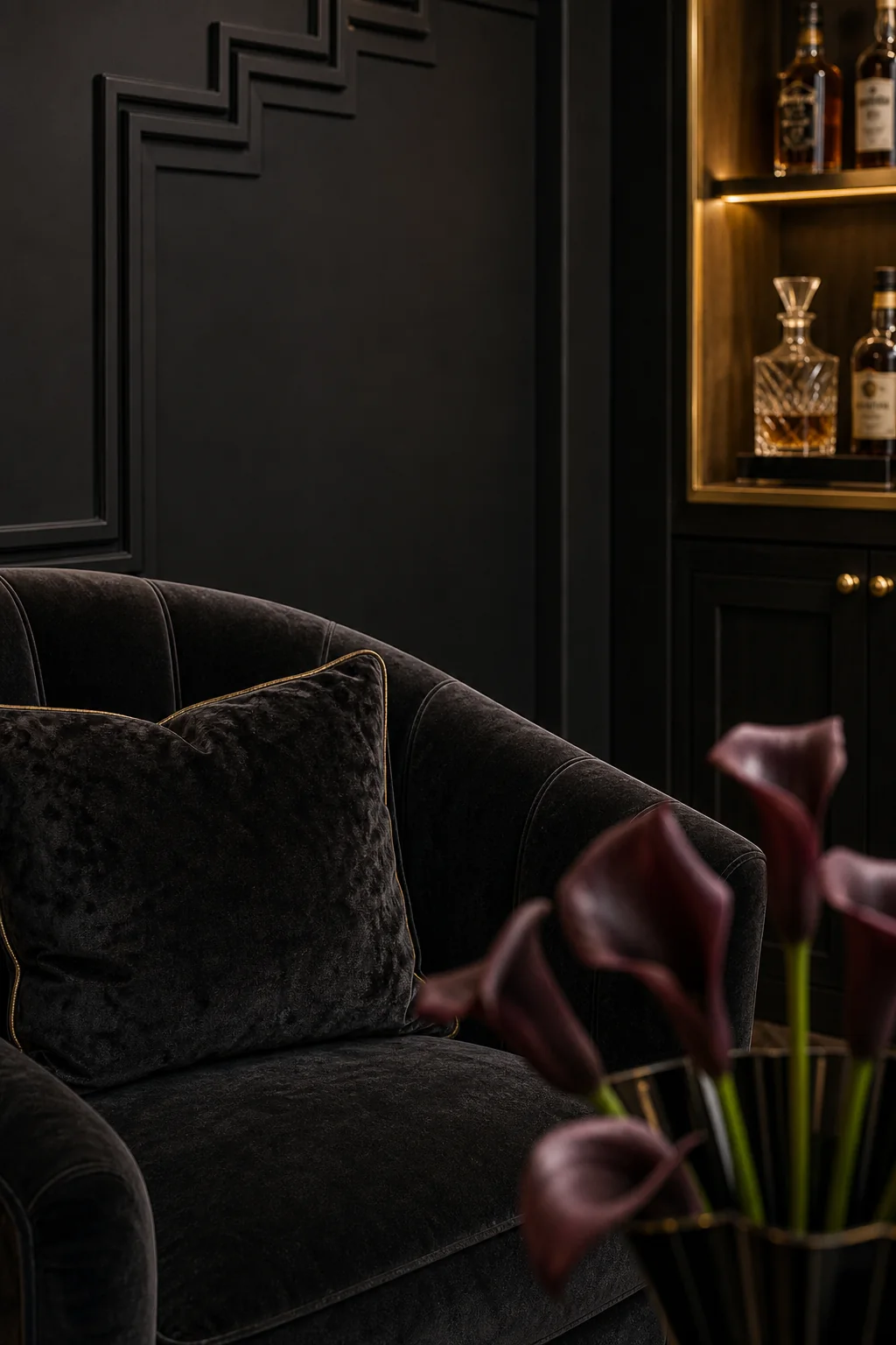 Balancing black and brushed gold in the finished whiskey lounge corner