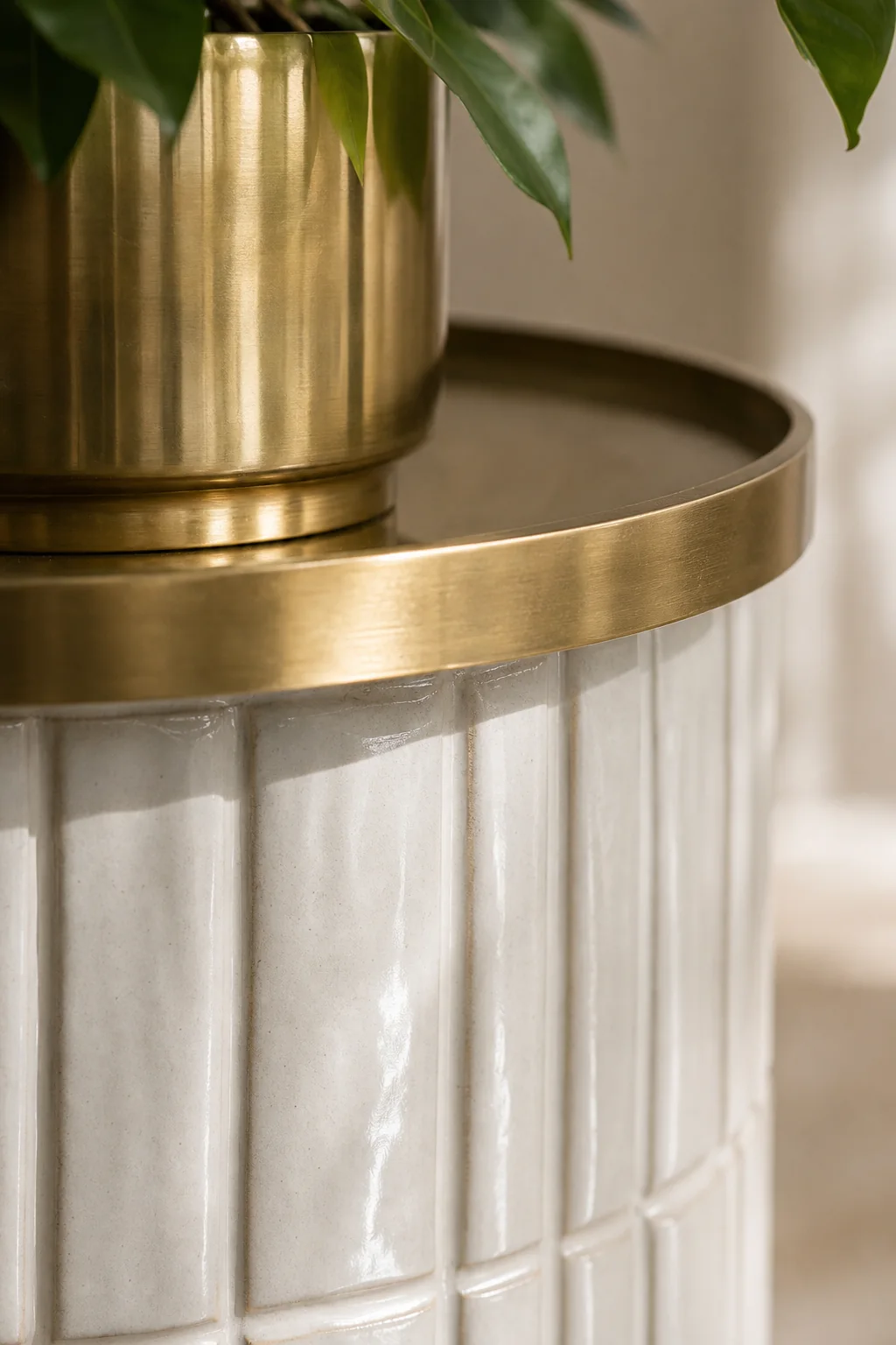 Grounding plants with metallic accents in the finished sunroom plant nook